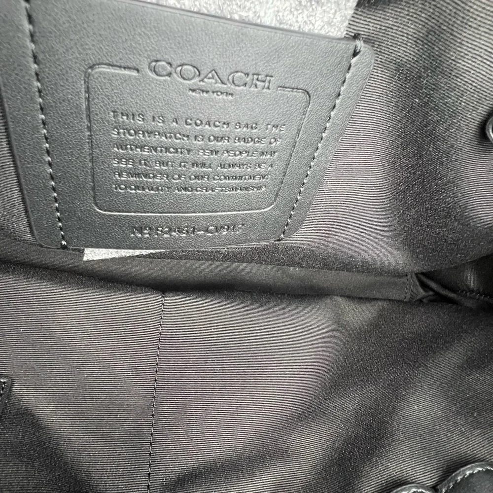 Coach Slim Brief In Signature Canvas With Trolley Sleeve